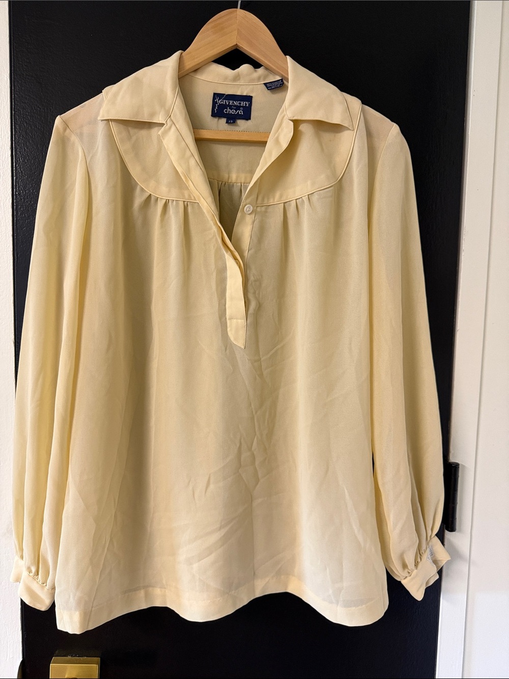 Givenchy for Chesa light yellow long-sleeve blouse features a distinctive yoked